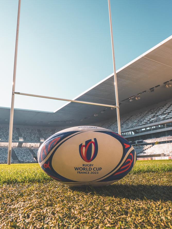 The Rugby World Cup France 2023 ball placed on the ground of the Stade of Bordeaux Matmut Atlantique pitch